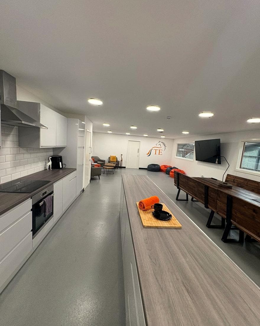 The communal hub in the Barn, with kitchen and seating.